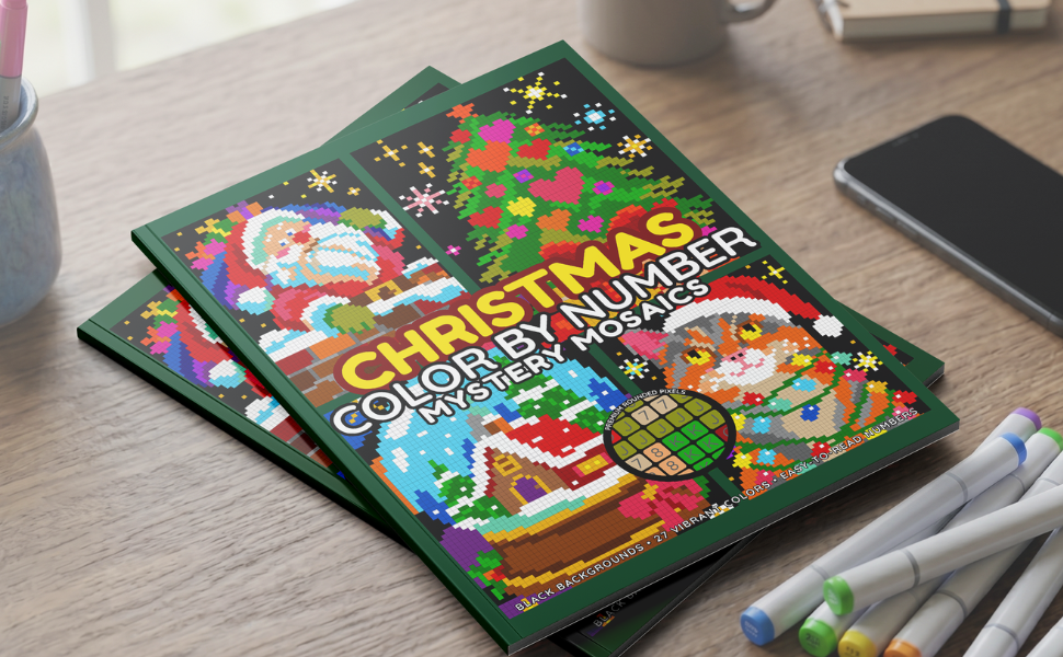 Christmas color by number book – paperback on desk with markers